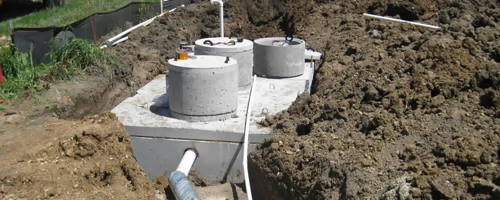 Septic system repair and installation site with tank access ports in Wilmington, NC