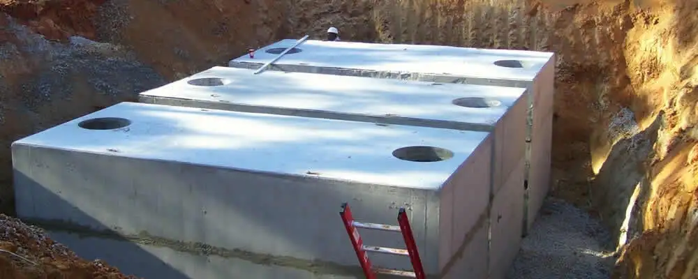 Septic tank installation site with a newly placed concrete tank in Wilmington, NC
